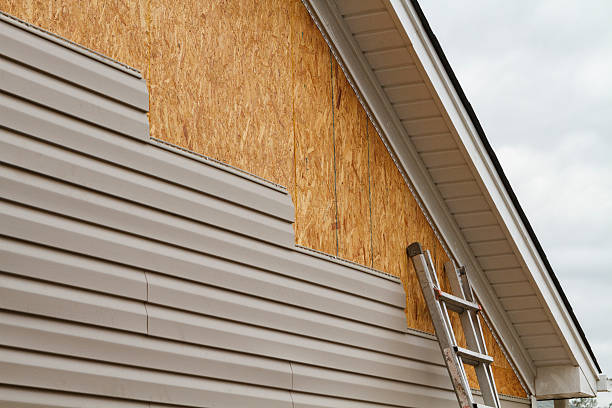 Professional Siding technician working in Wickhaven, PA